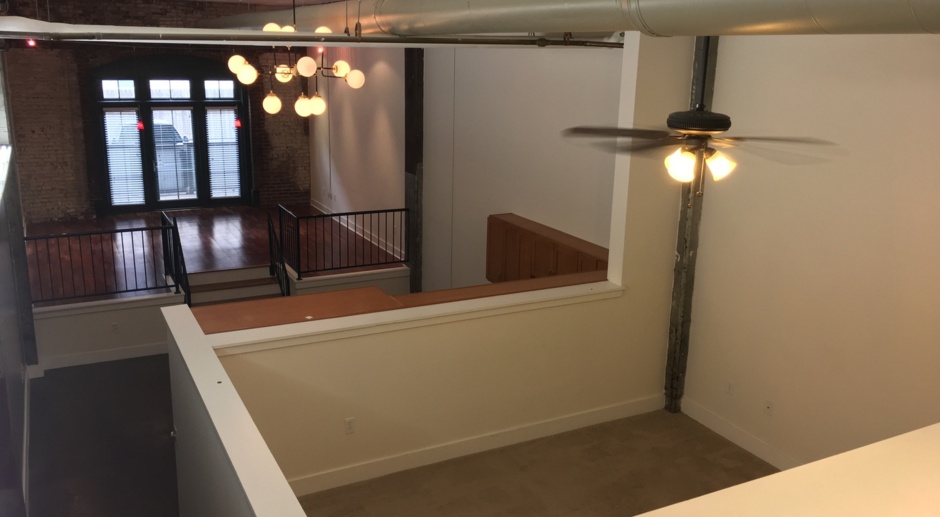 Huge 1 bd 1 bath with flex room in Lofts.  Includes 2 private parking spaces and private patio!  Water and trash included.  Pets are allowed. 